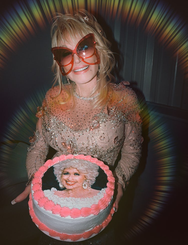 Parton wears her own custom dress by Steve Summers; Marc Jacobs sunglasses; Chopard earrings and rin...