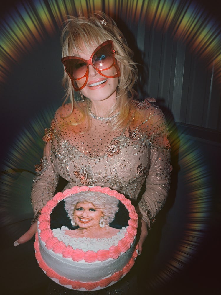 Parton wears her own custom dress by Steve Summers; Marc Jacobs sunglasses; Chopard earrings and rin...