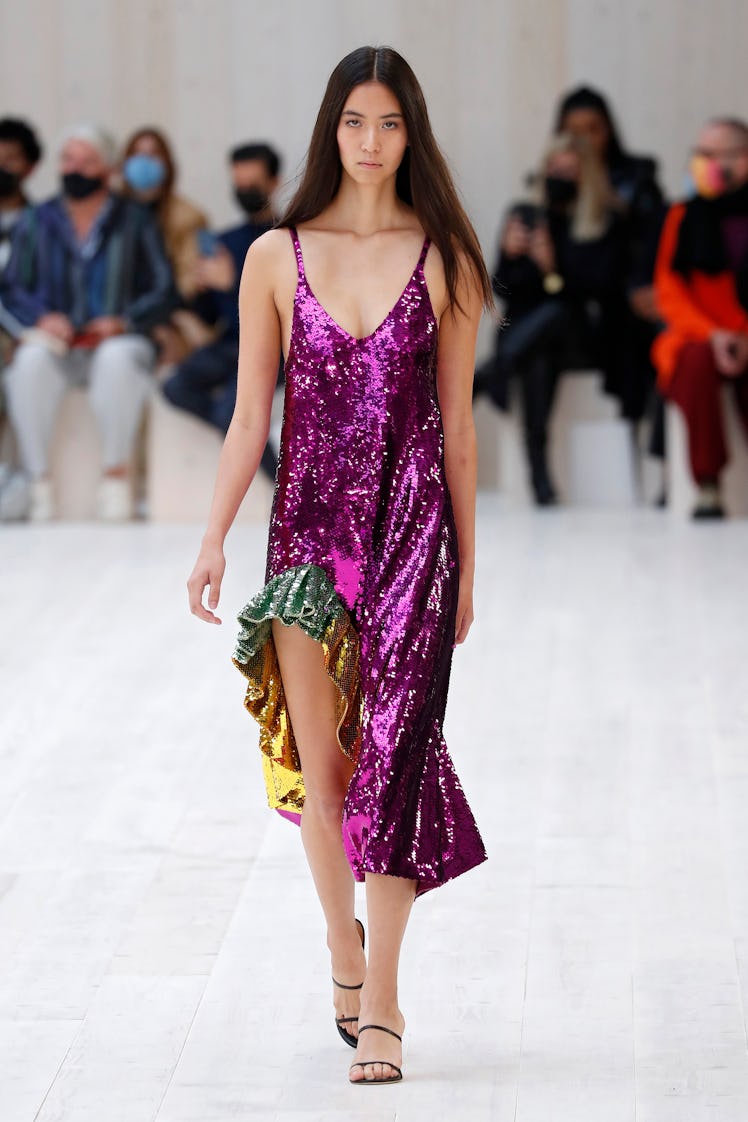 A model walking in a pink sequin dress at the Loewe spring 2022 show at Paris Fashion Week.