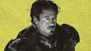 Robert Downey Jr. as Iron Man in black and white white a yellow and black striped backgournd