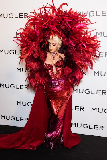 Cardi B in a full-feathered red fantasy dress. 