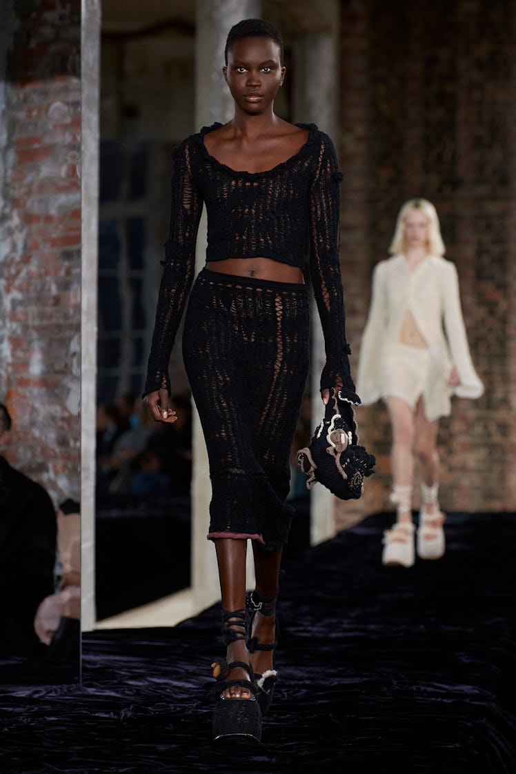 Model walks in Acne Studios Spring 2022 show at Paris Fashion Week.