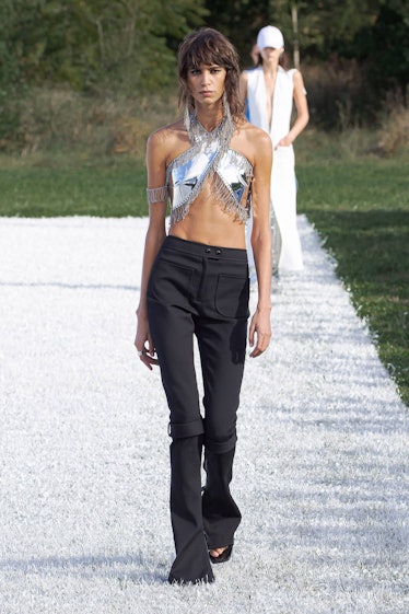 model in silver top and black pants by Courreges