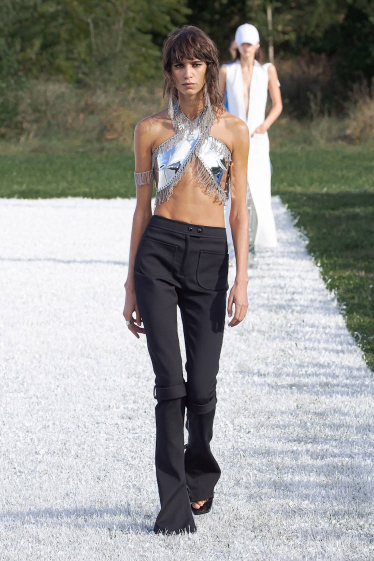A model in silver top and black pants by Courreges