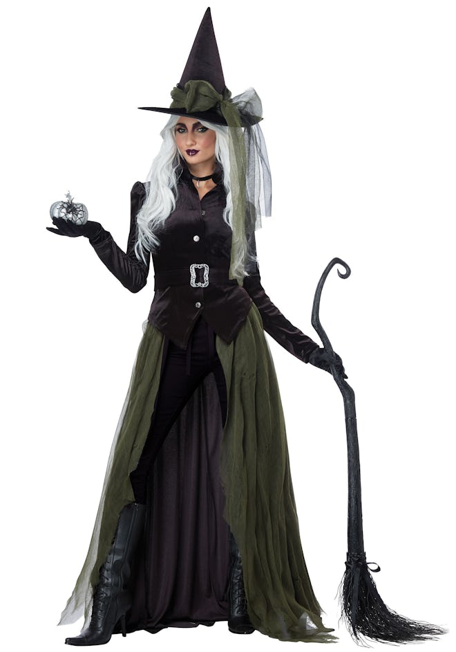 Adult woman posing in witch costume