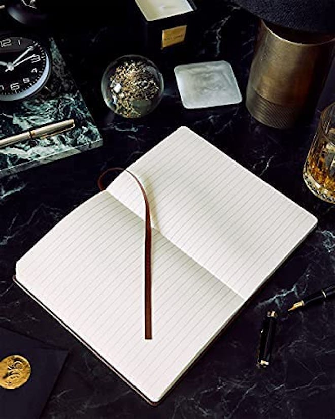 These leather reading journals are completely blank to give you complete flexibility in your book re...
