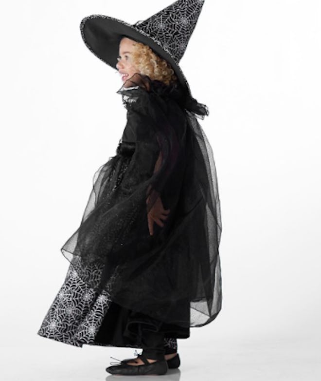 Girl dressed in glow in the dark wizard costume