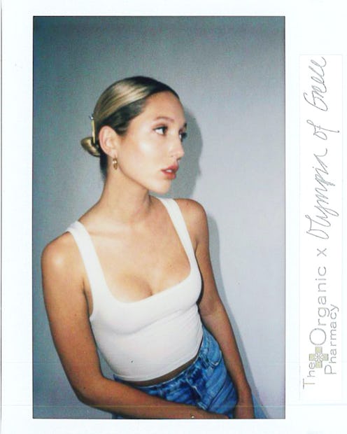 Princess Olympia of Greece in a white tank top and blue denim jeans