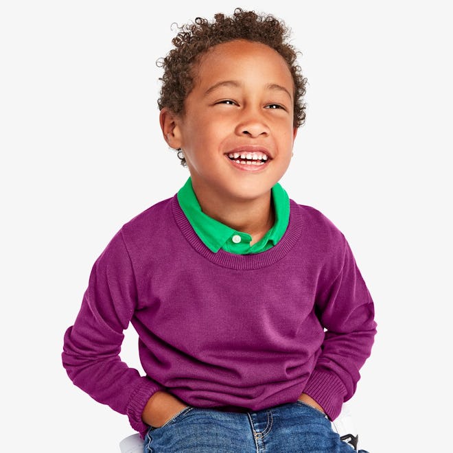 Little boy modeling purple sweater