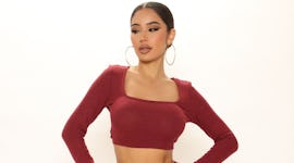 A model wearing Fashion Nova's Sweater Pant Set.