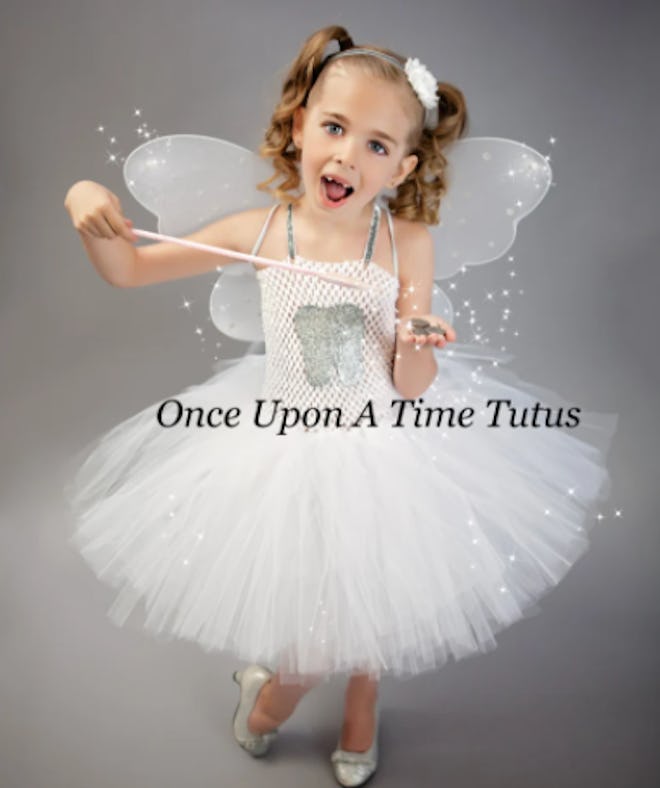 Girl dressed as the Tooth Fairy