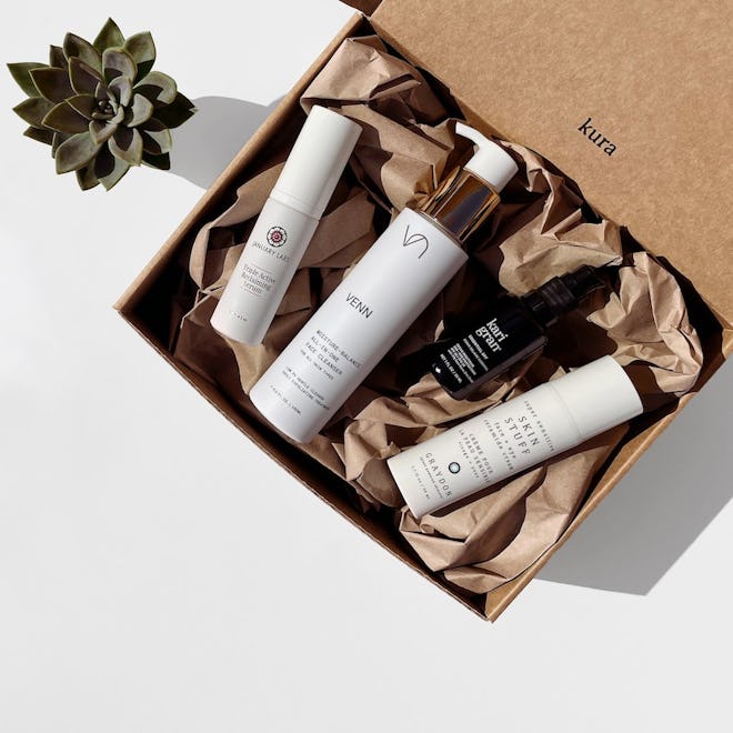 image of gift set with four clean beauty products from Kura Skin, together in cardboard box
