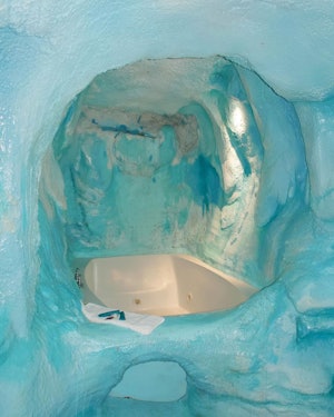 A bath tub surrounded by ice in a hotel room