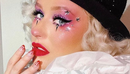 Christina Aguilera in glam clown costume and bloody nails