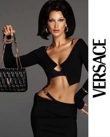 Bella Hadid with a versace Virtus bag. Sporting a higher-than-heaven beehive bob and the cardigan to...