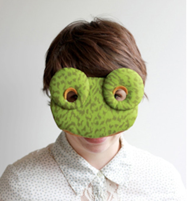 Child wearing a homemade frog mask