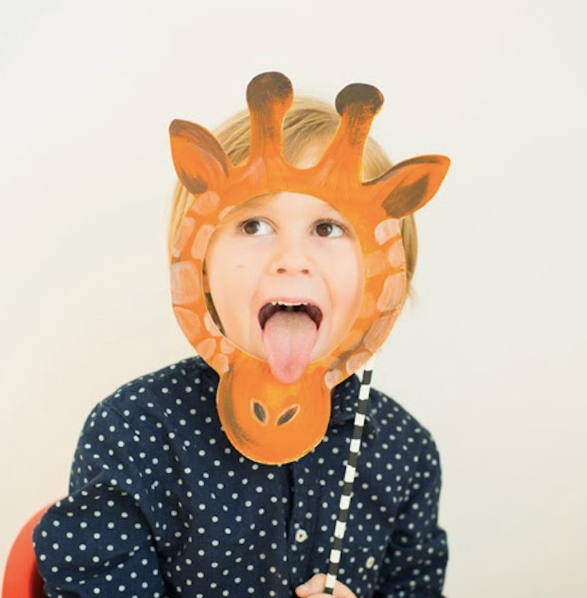 Child wearing a homemade giraffe mask