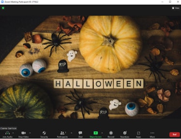 These Halloween Zoom backgrounds include a festive table design.