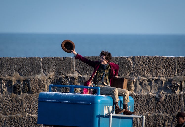 Timothée Chalamet is seen as Willy Wonka leaving the ship on the top of a van during filming for the...