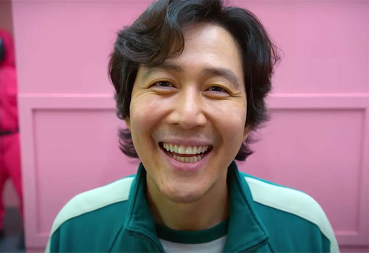 Gi-Hun in 'Squid Game' smiles for his picture like he would after receiving some 'Squid Game' birthd...