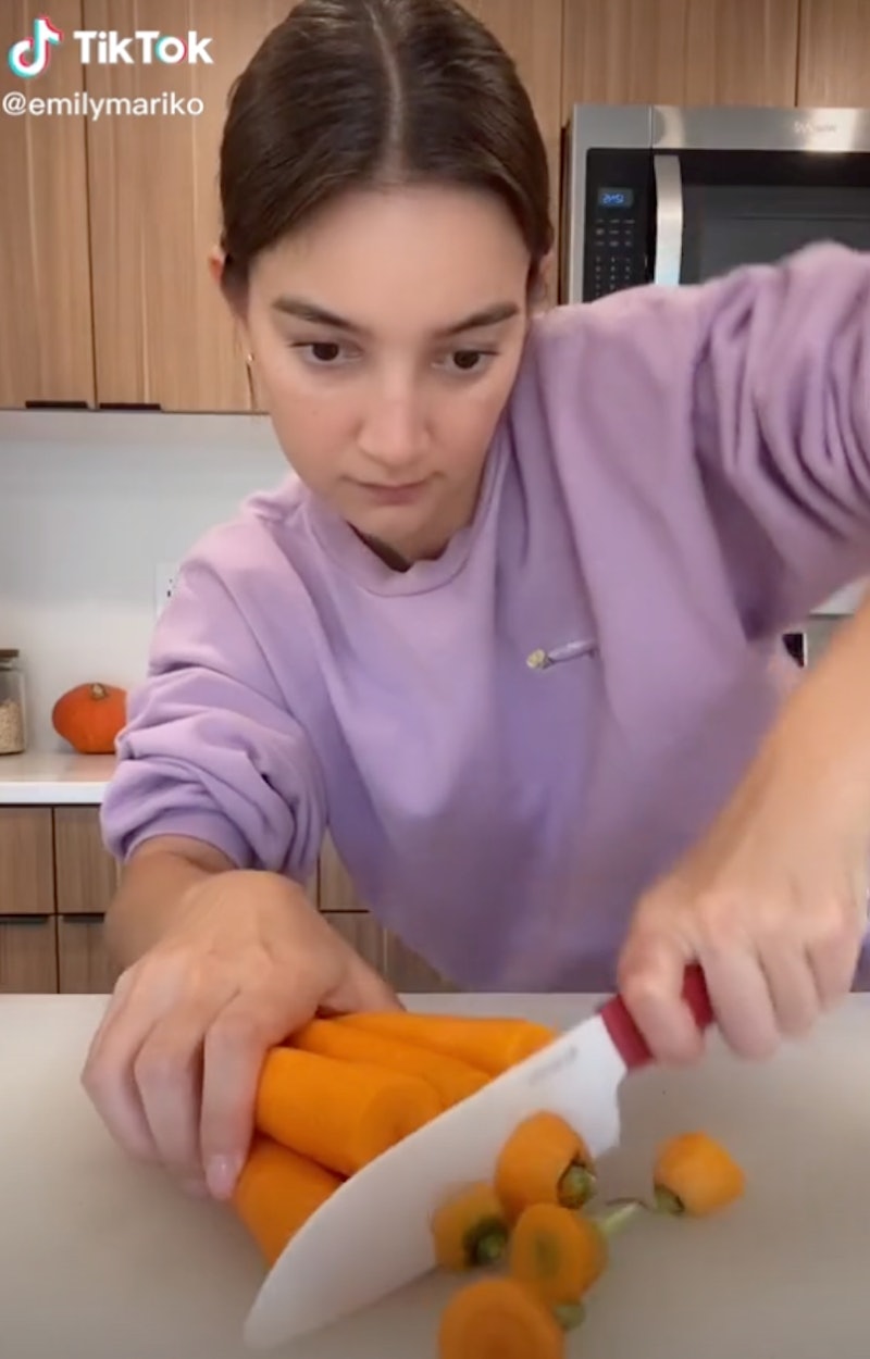 Emily Mariko prepares carrots in an ASMR cooking TikTok. These food tiktok accounts have super sooth...