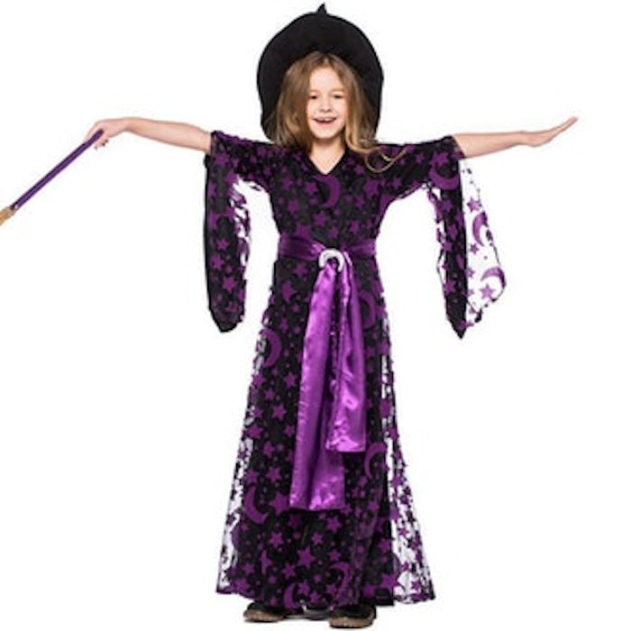 little girl in a purple witch dress from etsy