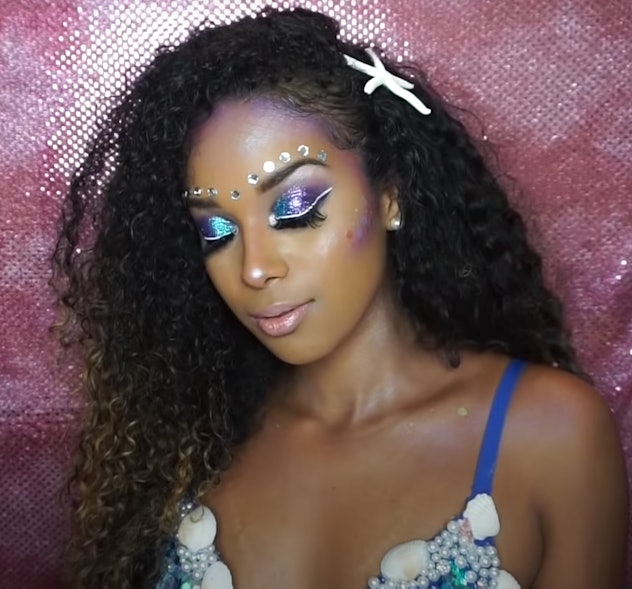 Woman posing, modeling mermaid makeup