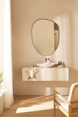 This irregular shaped mirror is sold by Zara's home decor line