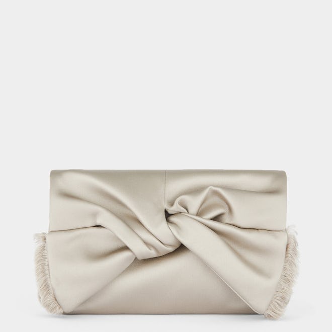 Bow Satin Clutch in Silver from Anya Hindmarch.