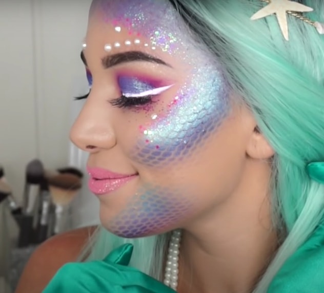 Profile view of woman modeling mermaid makeup