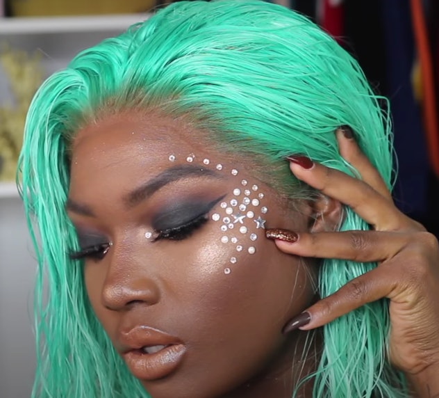 Woman modeling mermaid makeup