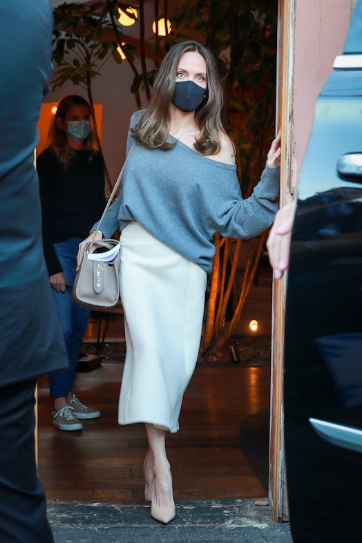 Angelina Jolie wearing a Loro Piana Sesia handbag. 