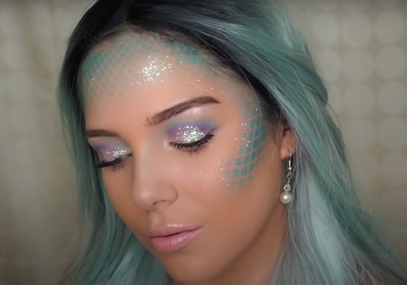 Woman modeling mermaid makeup