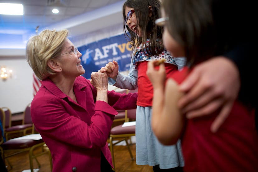 Democratic presidential hopeful, U.S. Sen. Elizabeth Warren (D-MA) locks pinky fingers with Rebecca ...