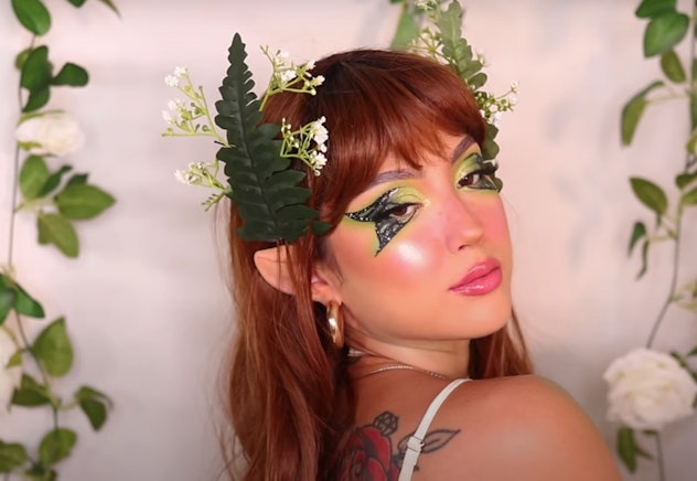 Woman with fairy makeup in shades of green