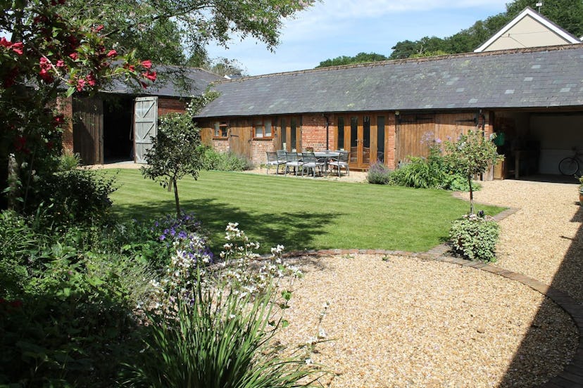A converted bard with a large garden and patio in Ringwood, New Forest