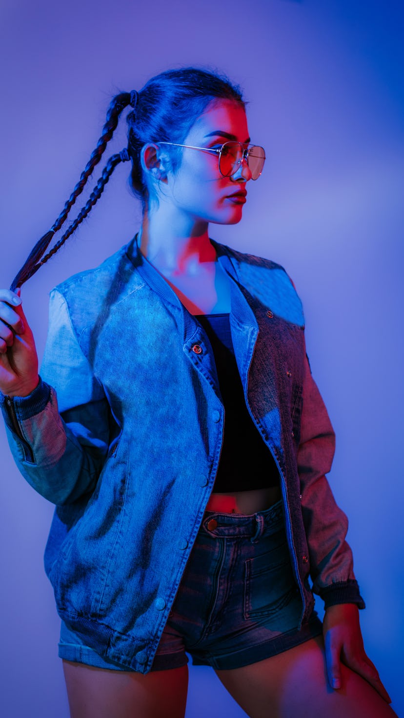 Young woman in purple light during the end of Neptune retrograde on Dec. 1, 2021.