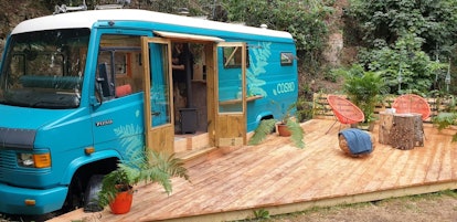 A blue camper van turned into an AirBnB in Wye Valley, Herefordshire