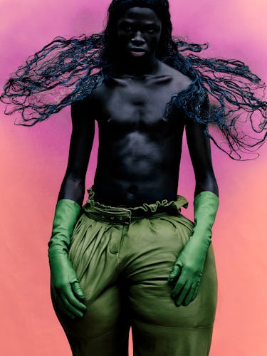 Abdullahi Amure wears Balmain Homme pants; Wing & Weft Gloves gloves.