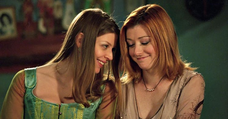 Buffy the Vampire Slayer characters Willow and Tara share a moment.