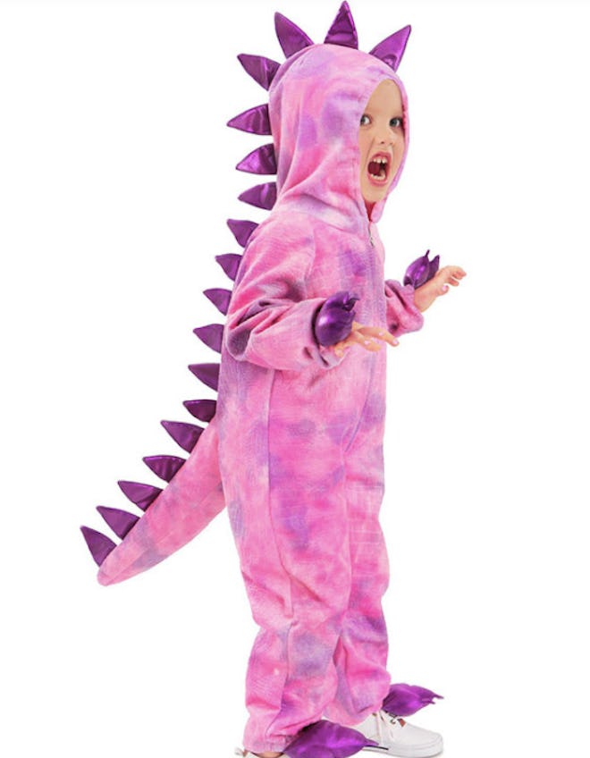 Child wearing pink dinosaur costume