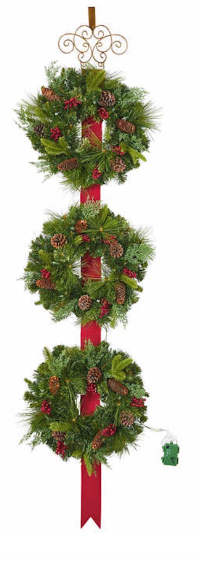 Image of three small wreaths, hanging vertically on a red ribbon.