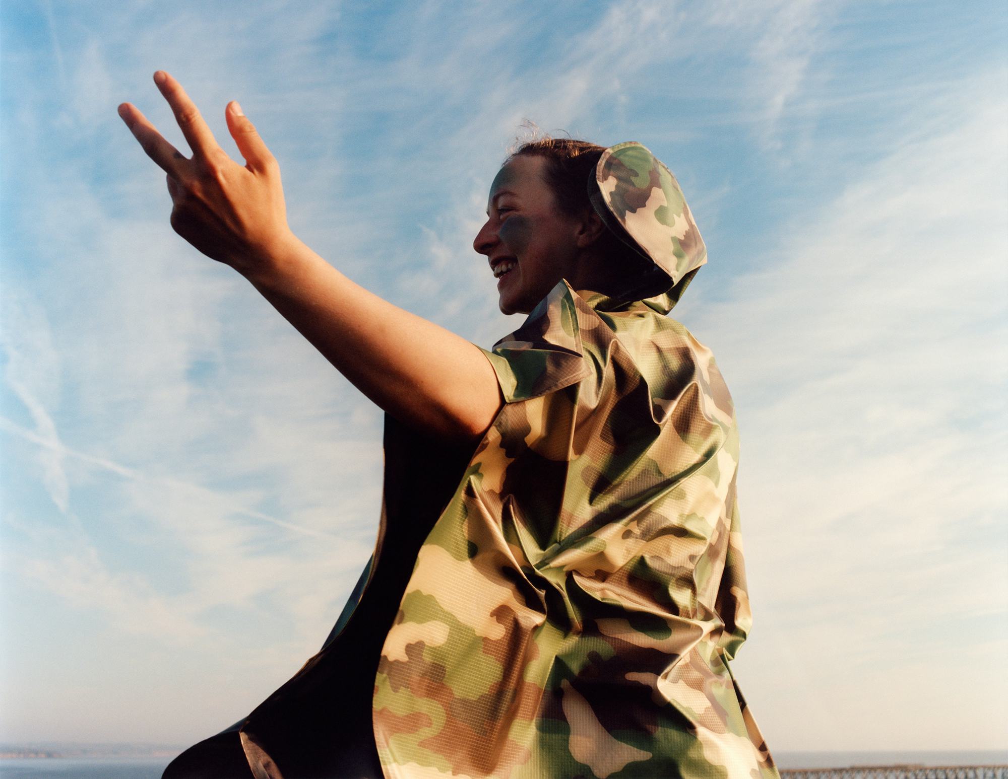 Model wears camouflage look from Junya Watanabe.