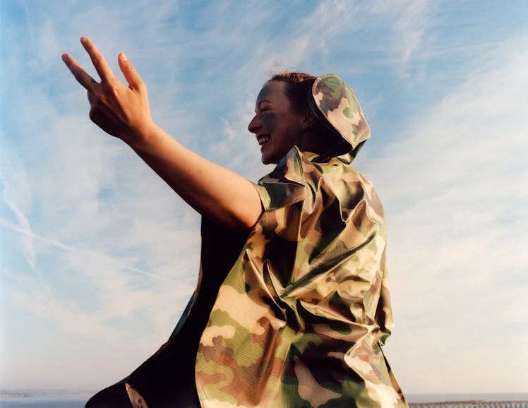 Model wears camouflage look from Junya Watanabe.
