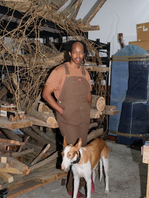 Hugh Hayden, with his dog, Mars, in his South Bronx studio.