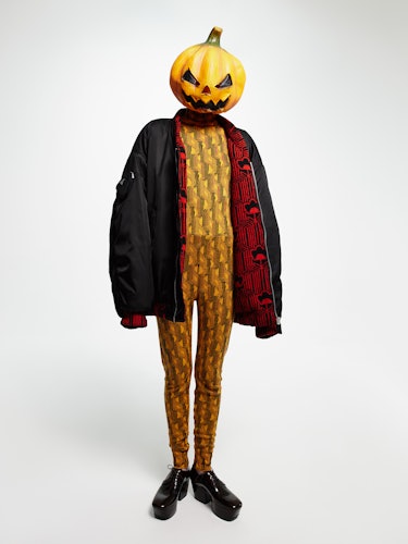 Prada jacket, long johns, and shoes; stylist’s own pumpkin mask.