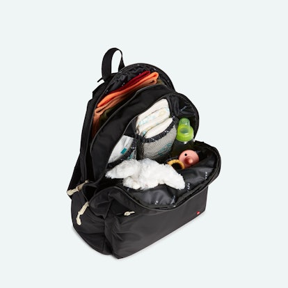 product shot of State Lorimer diaper bag filled with baby items.