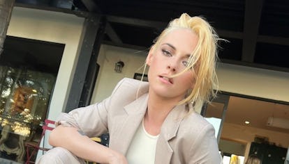 Kristen Stewart wearing Mango pantsuit and Converses.