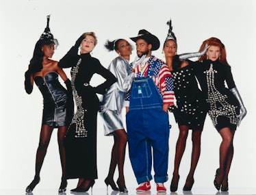 Patrick Kelly posing with five models