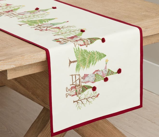 This Forest Gnome Embroidered Cotton Table Runner is available from Pottery Barn.